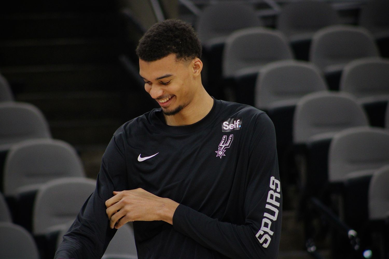 Jan 4, 2024; San Antonio, Texas, USA; San Antonio Spurs rookie Victor Wembanyama (1) smiles while listening to fans sing him 'Happy Birthday' prior to facing the Milwaukee Bucks.